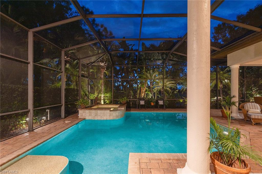9038 Shenendoah Circle Naples, FL 34113 - Photo 33 of 50 a view of a chairs and table in a patio