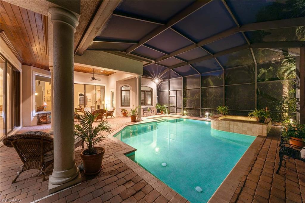 9038 Shenendoah Circle Naples, FL 34113 - Photo 36 of 50 a swimming pool with outdoor seating and yard