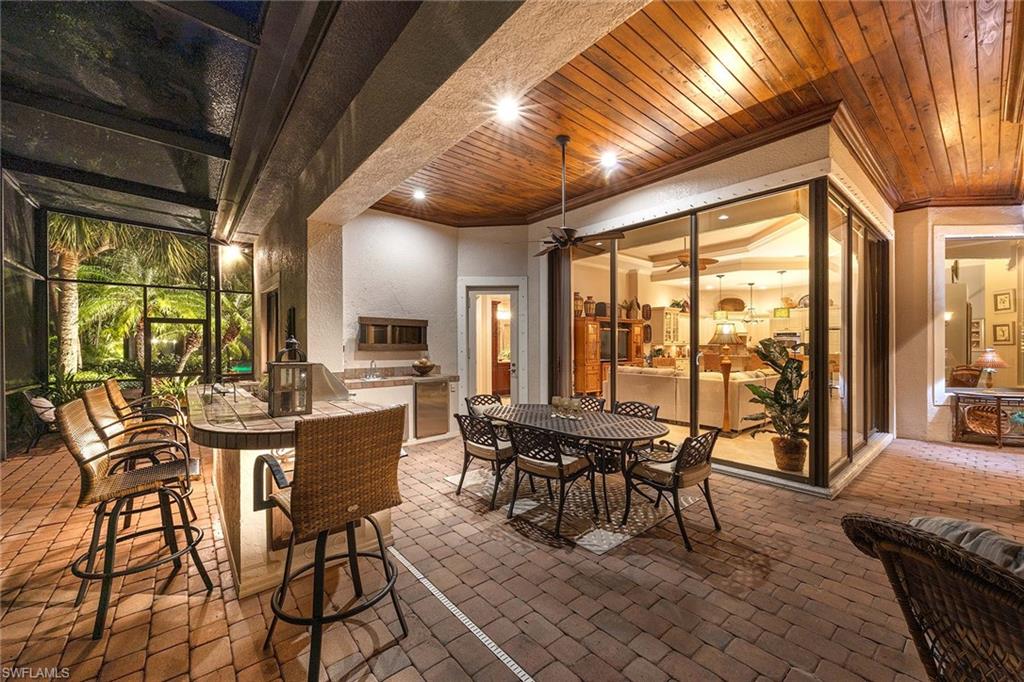 9038 Shenendoah Circle Naples, FL 34113 - Photo 37 of 50 a view of a dining room with furniture window and outside view