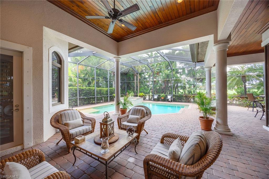 9038 Shenendoah Circle Naples, FL 34113 - Photo 40 of 50 a living room with furniture and a large window