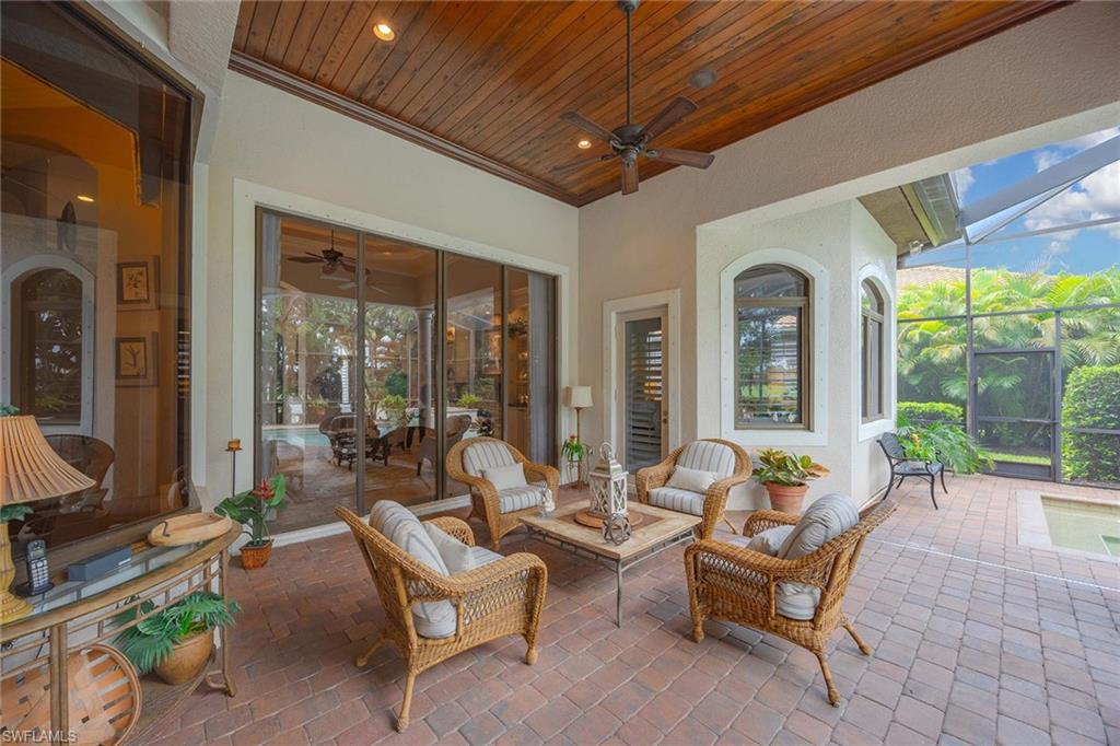 9038 Shenendoah Circle Naples, FL 34113 - Photo 41 of 50 a building outdoor space with patio furniture and potted plants
