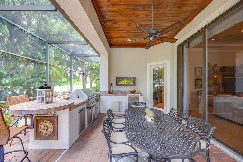 9038 Shenendoah Circle Naples, FL 34113 - Photo 42 of 50 a dining room with furniture window wooden floor