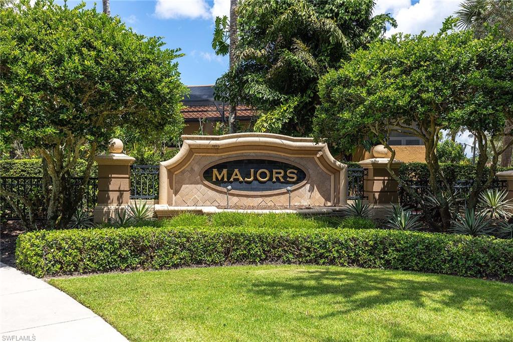 9038 Shenendoah Circle Naples, FL 34113 - Photo 45 of 50 a sign of golf club on a wall under a tree