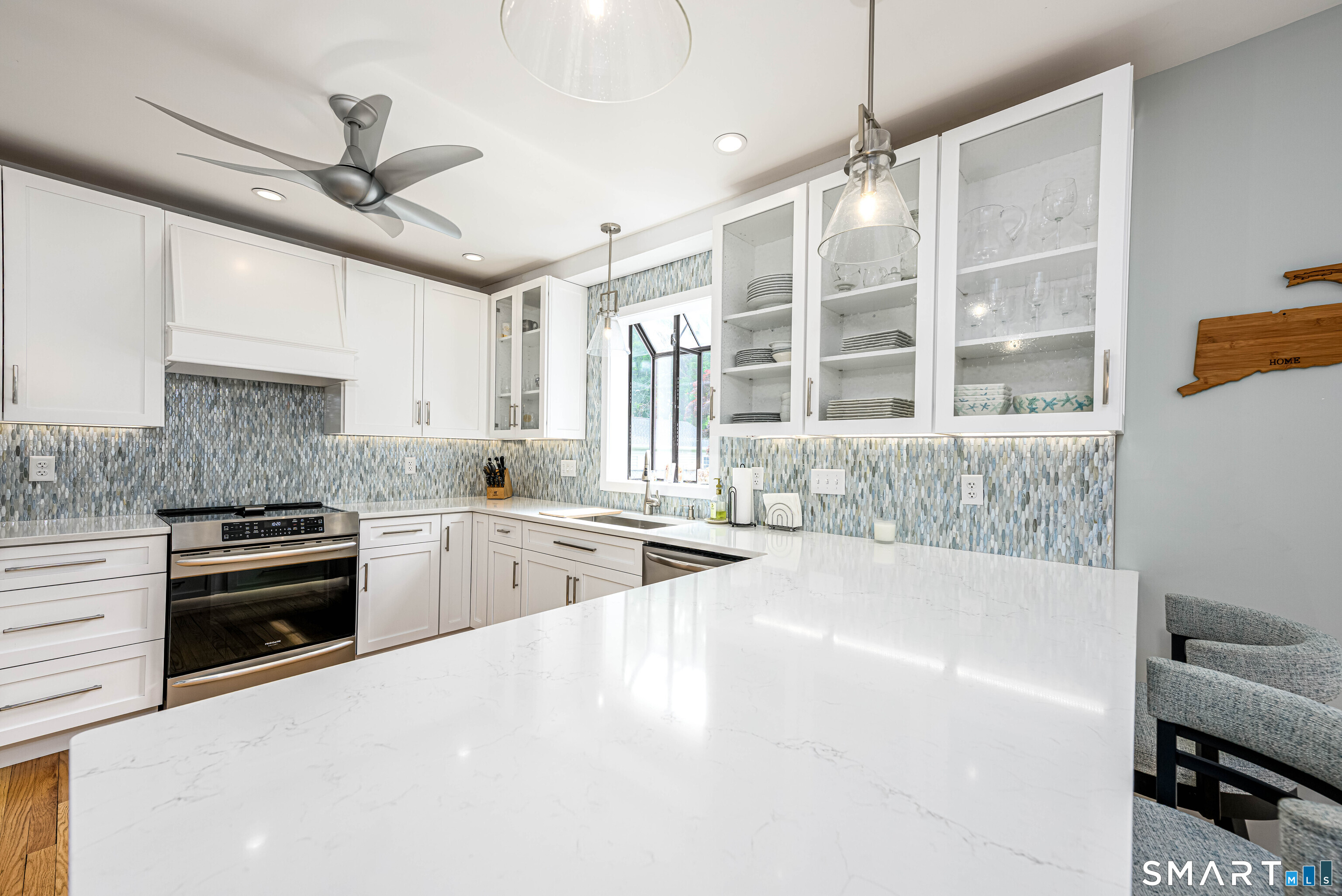 77 Prospect Road East Haven, CT 06512 - Photo 1 of 31 Remodeled kitchen, custom cabinets, quartz countertops, high end SS appliances including and Induction range, garden window,ceiling fan and hardwood floors.