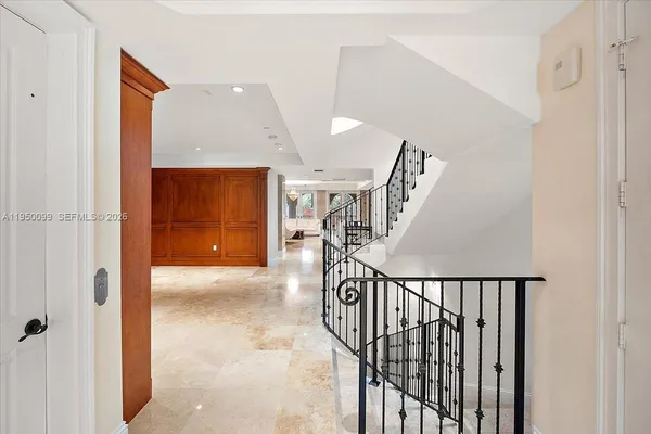 a kitchen with granite countertop a sink and cabinets