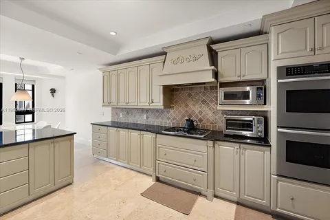 a living room with granite countertop furniture and a wooden floor