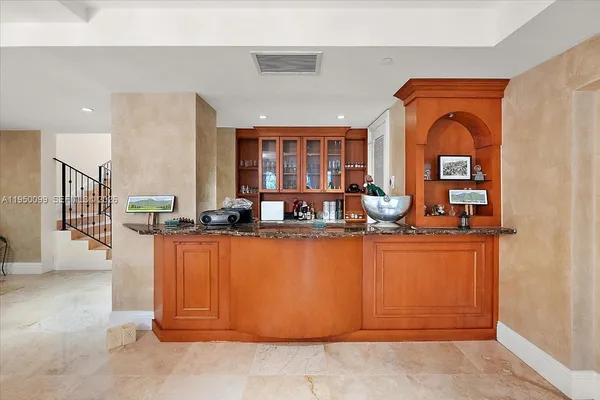 a living room with furniture and a stairs