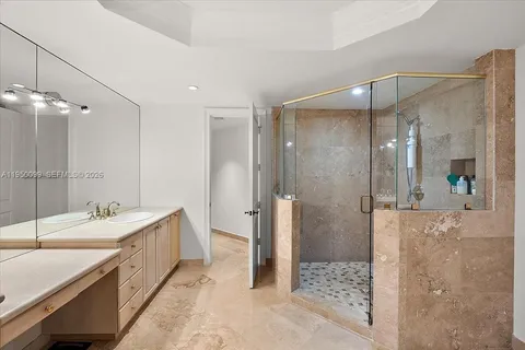 a bathroom with a double vanity sink mirror and toilet