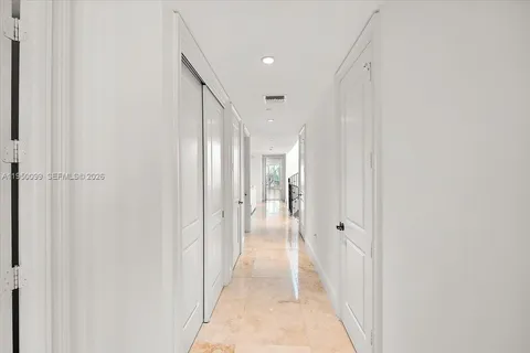 a view of a patio with couches and a potted plant on a table