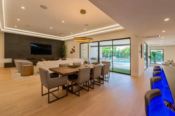 a very nice looking living room with a large window and a flat screen tv