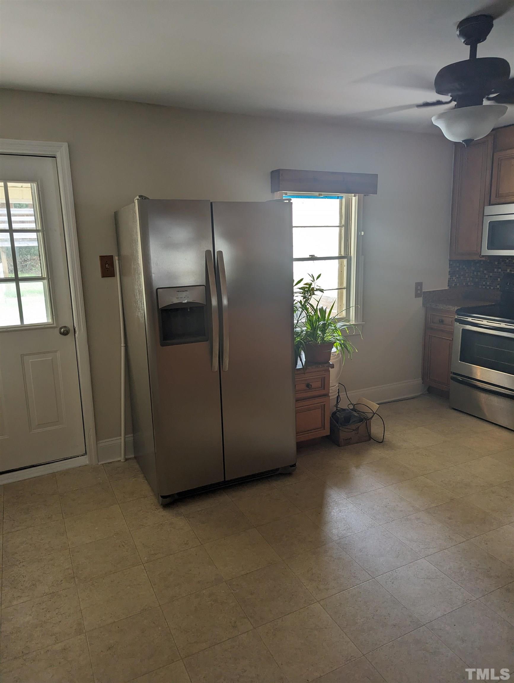 208 East Main Street Coats, NC 27521 - Photo 11 of 27 a view of empty room with windows