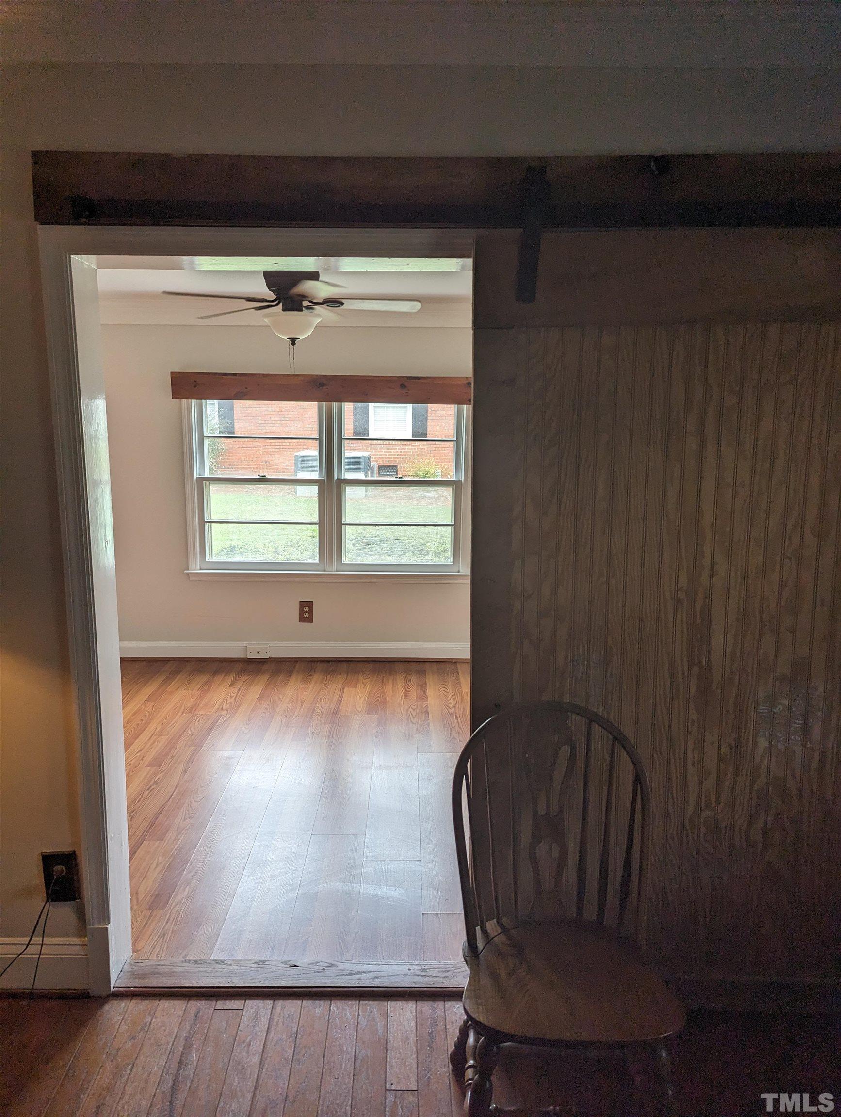 208 East Main Street Coats, NC 27521 - Photo 15 of 27 a view of wooden floor and windows in a room
