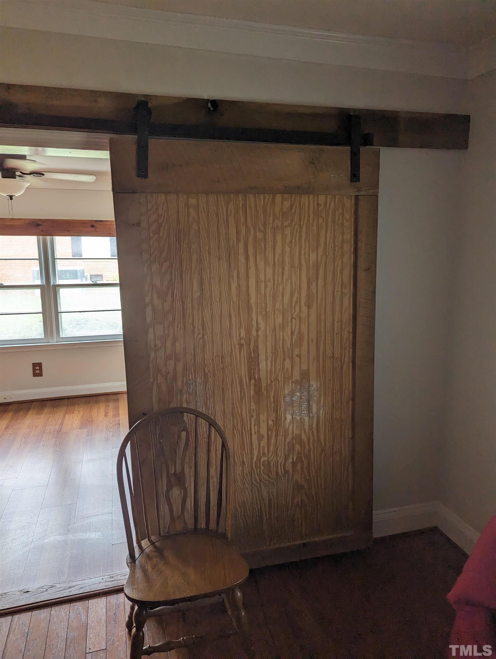 208 East Main Street Coats, NC 27521 - Photo 16 of 27 a view of a room with wooden floor and chair