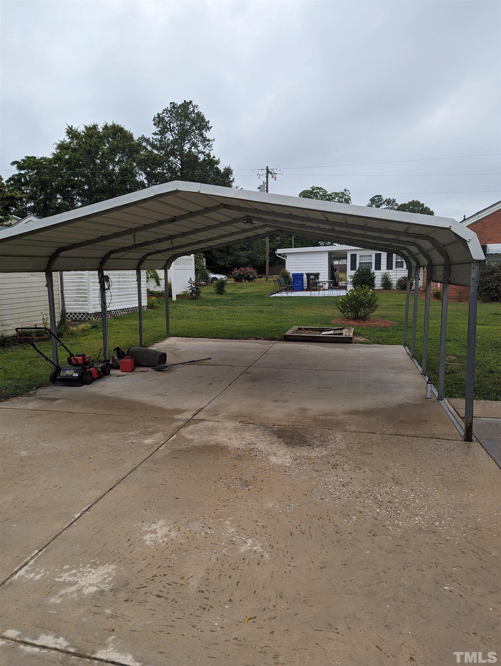 208 East Main Street Coats, NC 27521 - Photo 23 of 27 a pathway of a house with a yard
