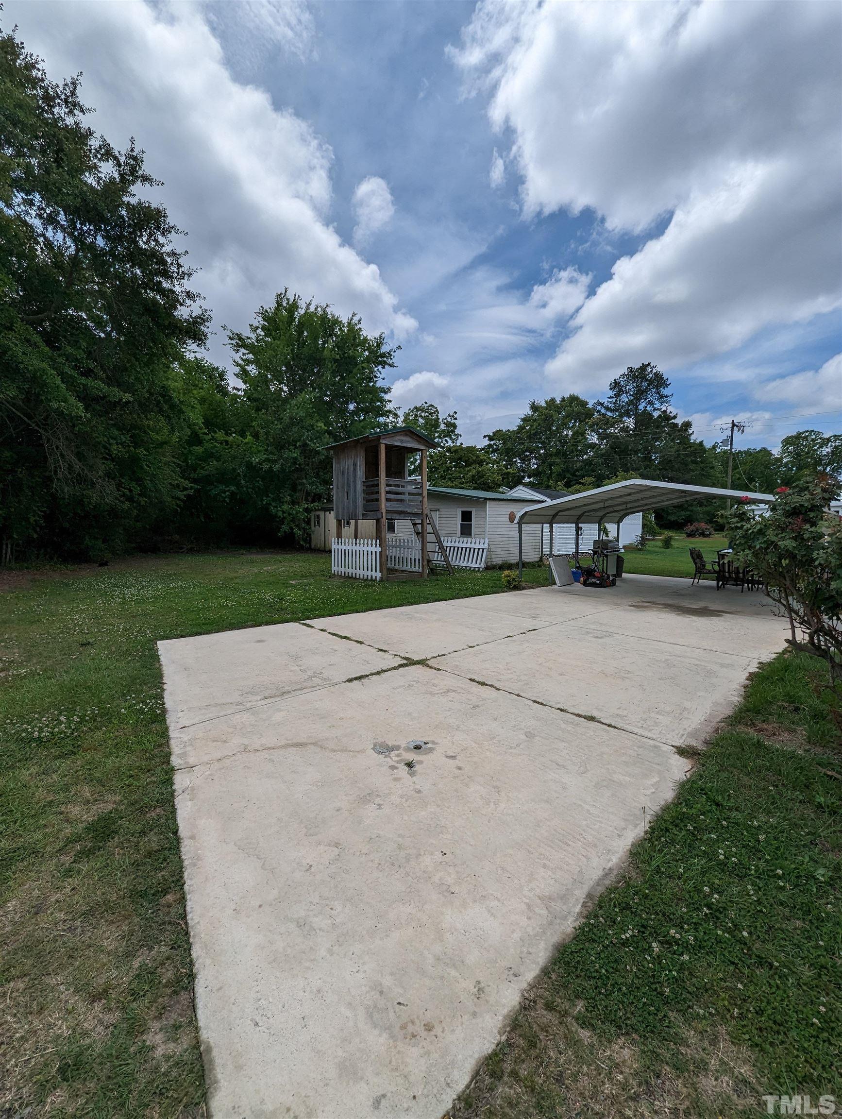208 East Main Street Coats, NC 27521 - Photo 24 of 27 a view of lake with outdoor space