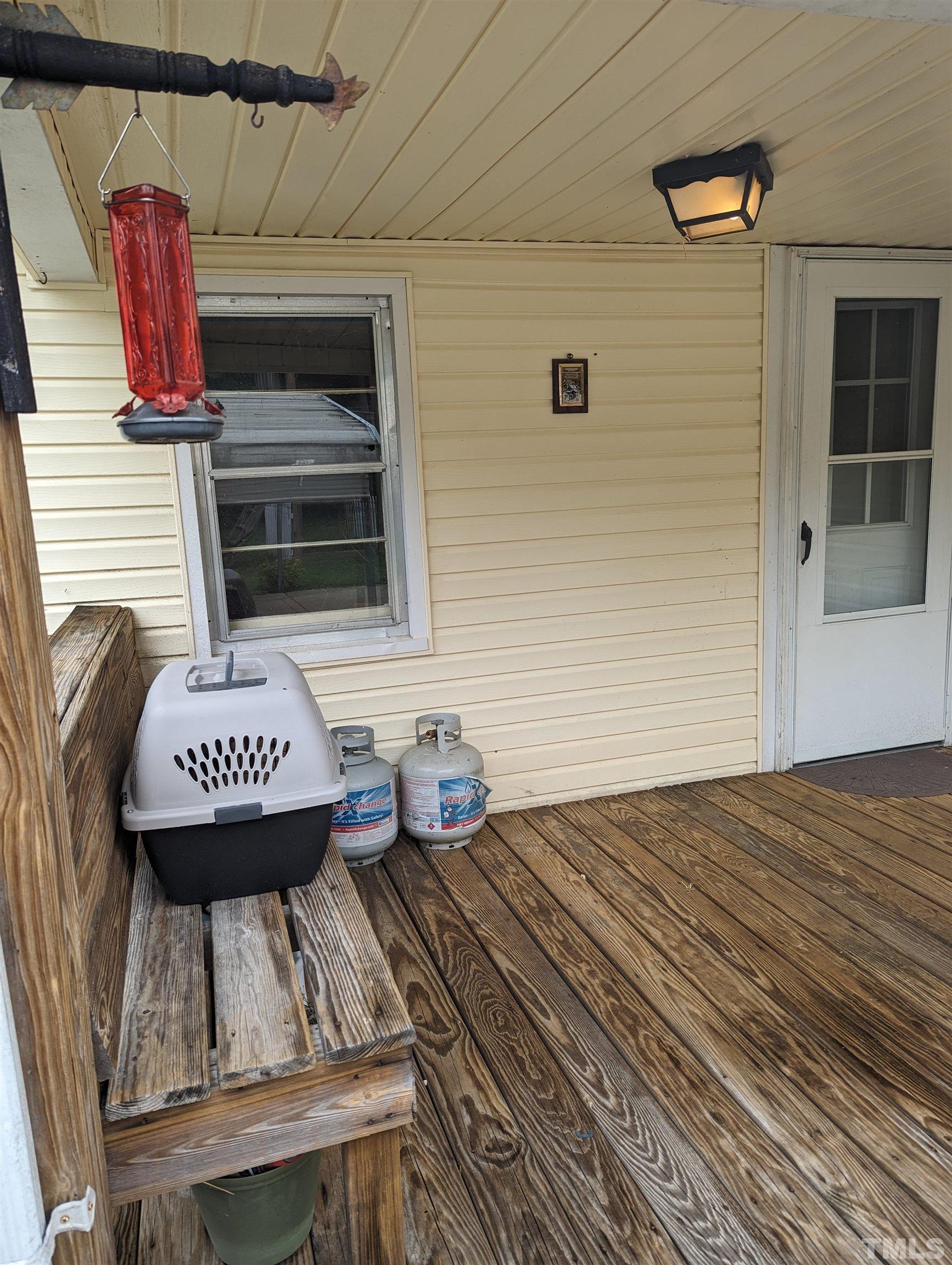 208 East Main Street Coats, NC 27521 - Photo 27 of 27 a view of a balcony with furniture
