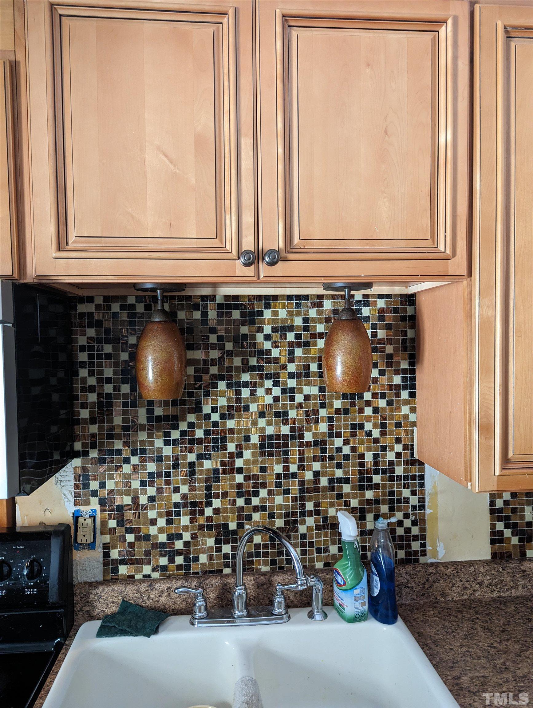 208 East Main Street Coats, NC 27521 - Photo 9 of 27 a bathroom with a sink and a mirror