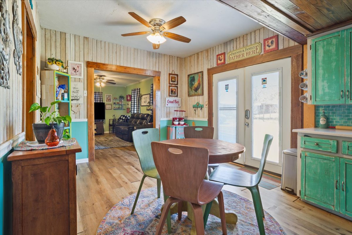 2804 Auction Barn Road Belton, TX 76513 - Photo 8 of 22 Dining space featuring light wood-style flooring, french doors, and ceiling fan