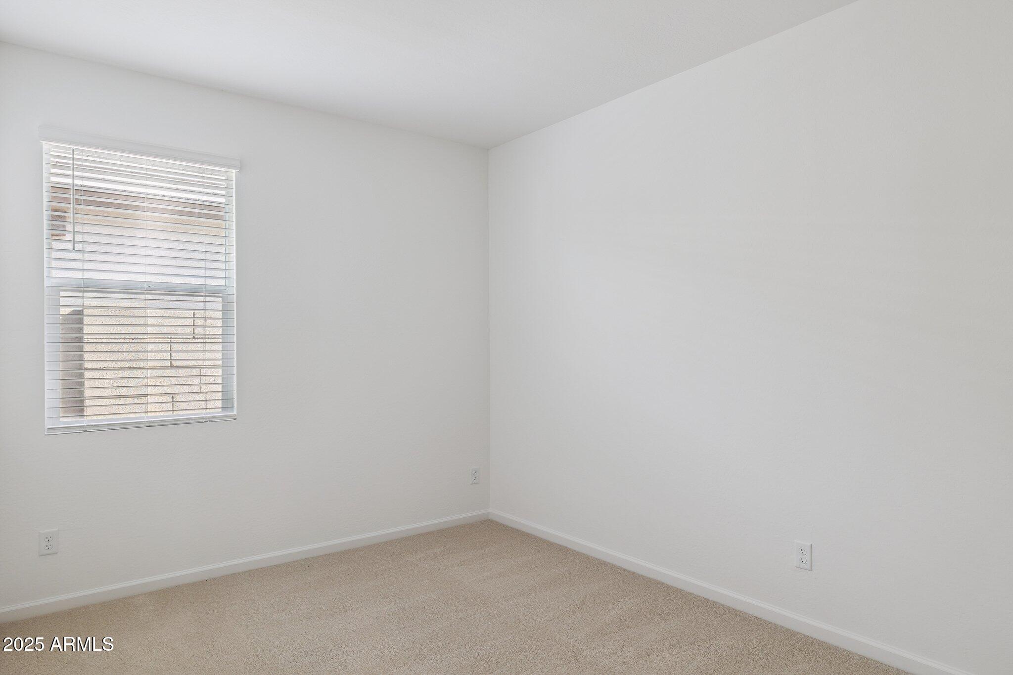 25471 West Fraktur Road Buckeye, AZ 85326 - Photo 12 of 17 a view of an empty room with a window