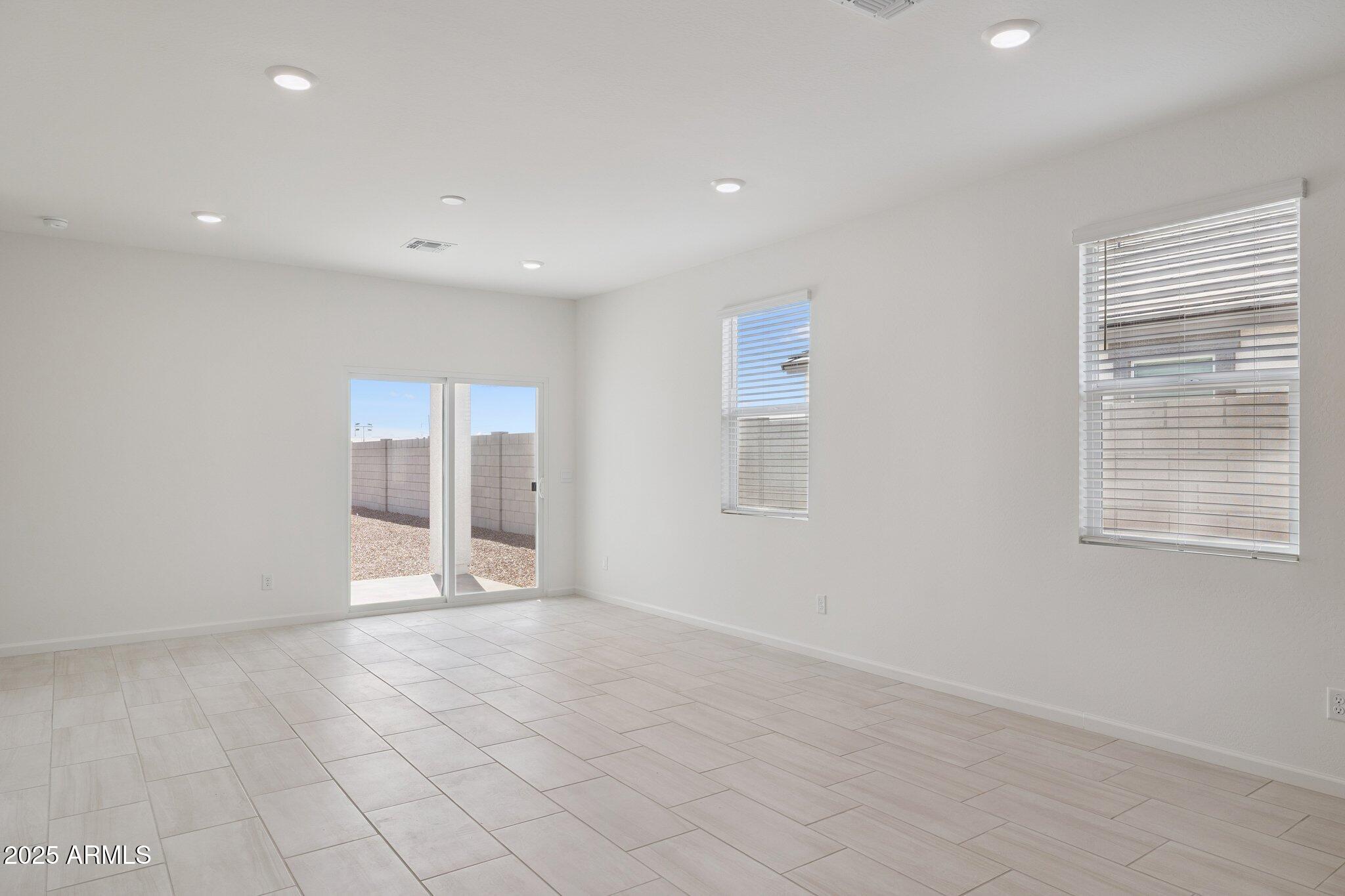 25471 West Fraktur Road Buckeye, AZ 85326 - Photo 3 of 17 a view of an empty room with a window