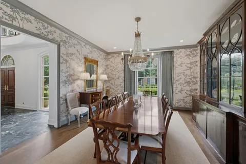 a living room with furniture fireplace and a large window