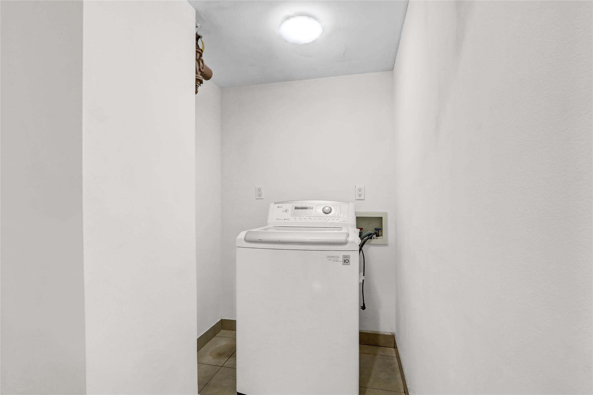 43-17 Union Street, Unit 5A Queens, NY 11355 - Photo 19 of 19 Washroom with washer / dryer and tile patterned floors