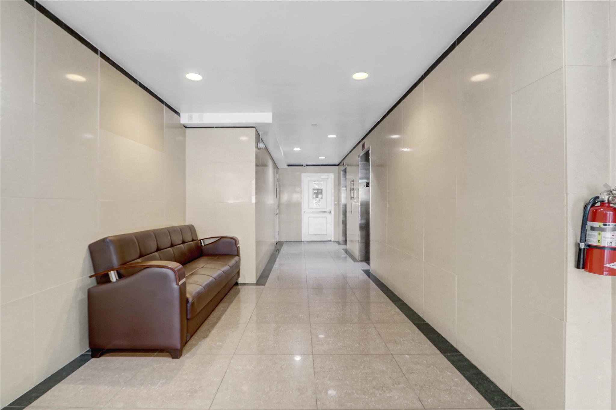 43-17 Union Street, Unit 5A Queens, NY 11355 - Photo 4 of 19 Corridor with recessed lighting and elevator