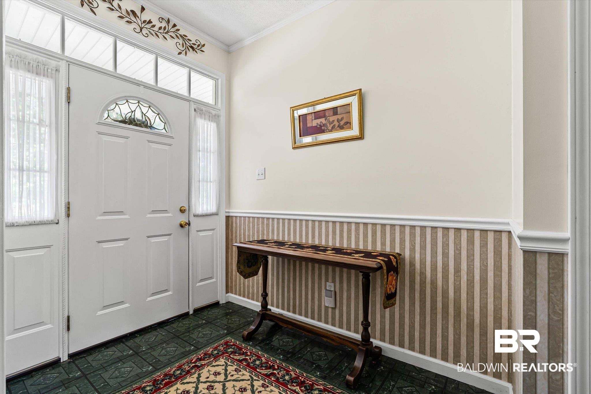 431 Simms Drive Saraland, AL 36571 - Photo 4 of 34 Entryway with wainscoting and crown molding