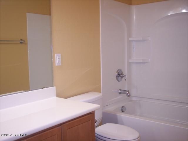 21321 East Reunion Road Red Rock, AZ 85145 - Photo 29 of 34 a bathroom with a sink toilet vanity and bathtub