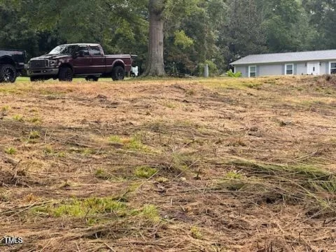 a view of a yard with a tree