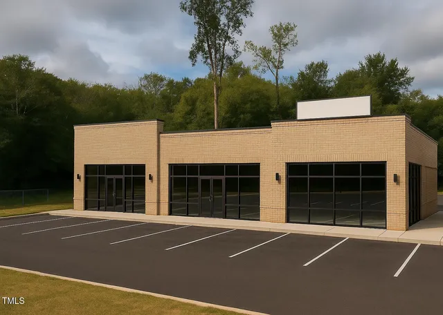 a view of a house with a backyard and a garage