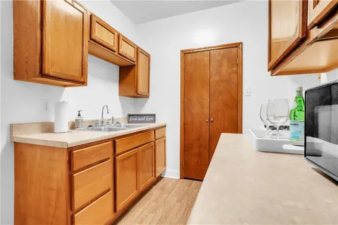 a bedroom with a bed and cabinets