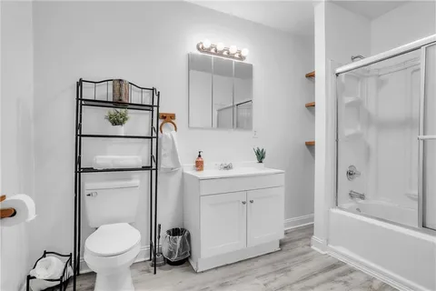 a bathroom with a bathtub and a shower
