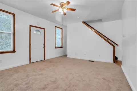 a view of an empty room with a window