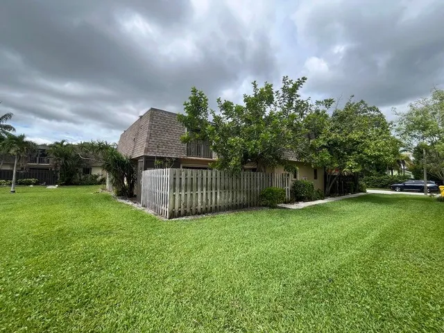 a view of a garden in front of a house