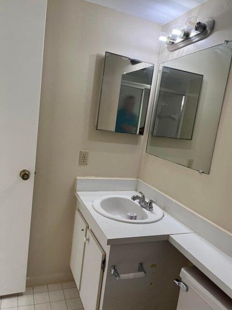 4803 Waterview Circle Palm Springs, FL 33461 - Photo 14 of 22 a bathroom with a sink a mirror and vanity