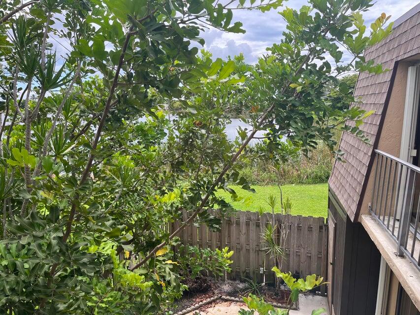 4803 Waterview Circle Palm Springs, FL 33461 - Photo 17 of 22 a view of a backyard with sitting area