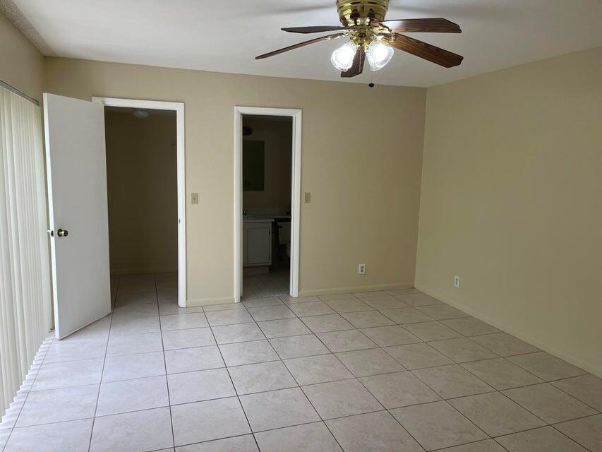 4803 Waterview Circle Palm Springs, FL 33461 - Photo 10 of 22 a view of an empty room with a window