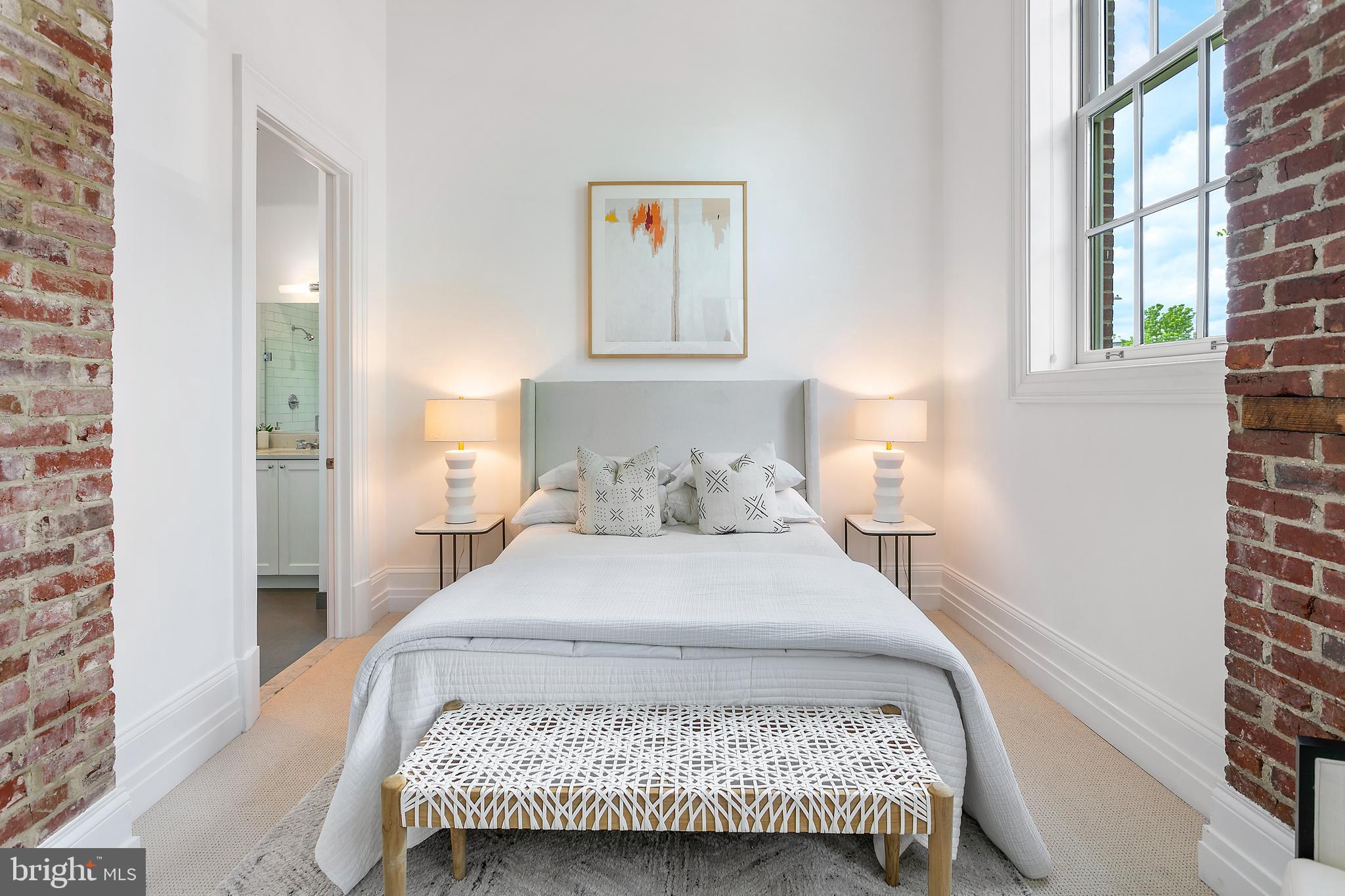 901 D Street Northeast, Unit 102 Washington, DC 20002 - Photo 16 of 40 a bedroom with a bed and a window with wall