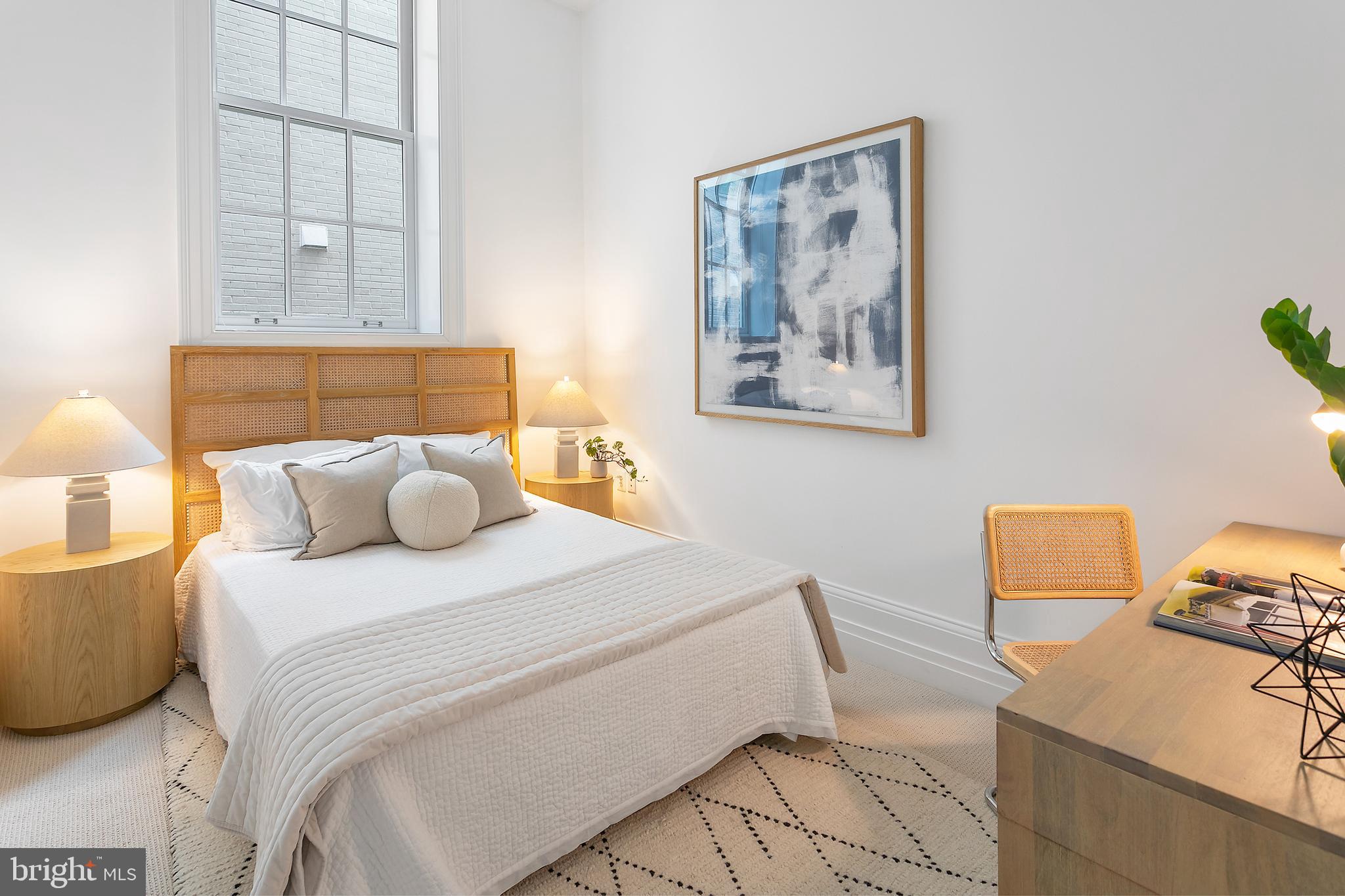 901 D Street Northeast, Unit 102 Washington, DC 20002 - Photo 24 of 40 a bedroom with a bed and lamp