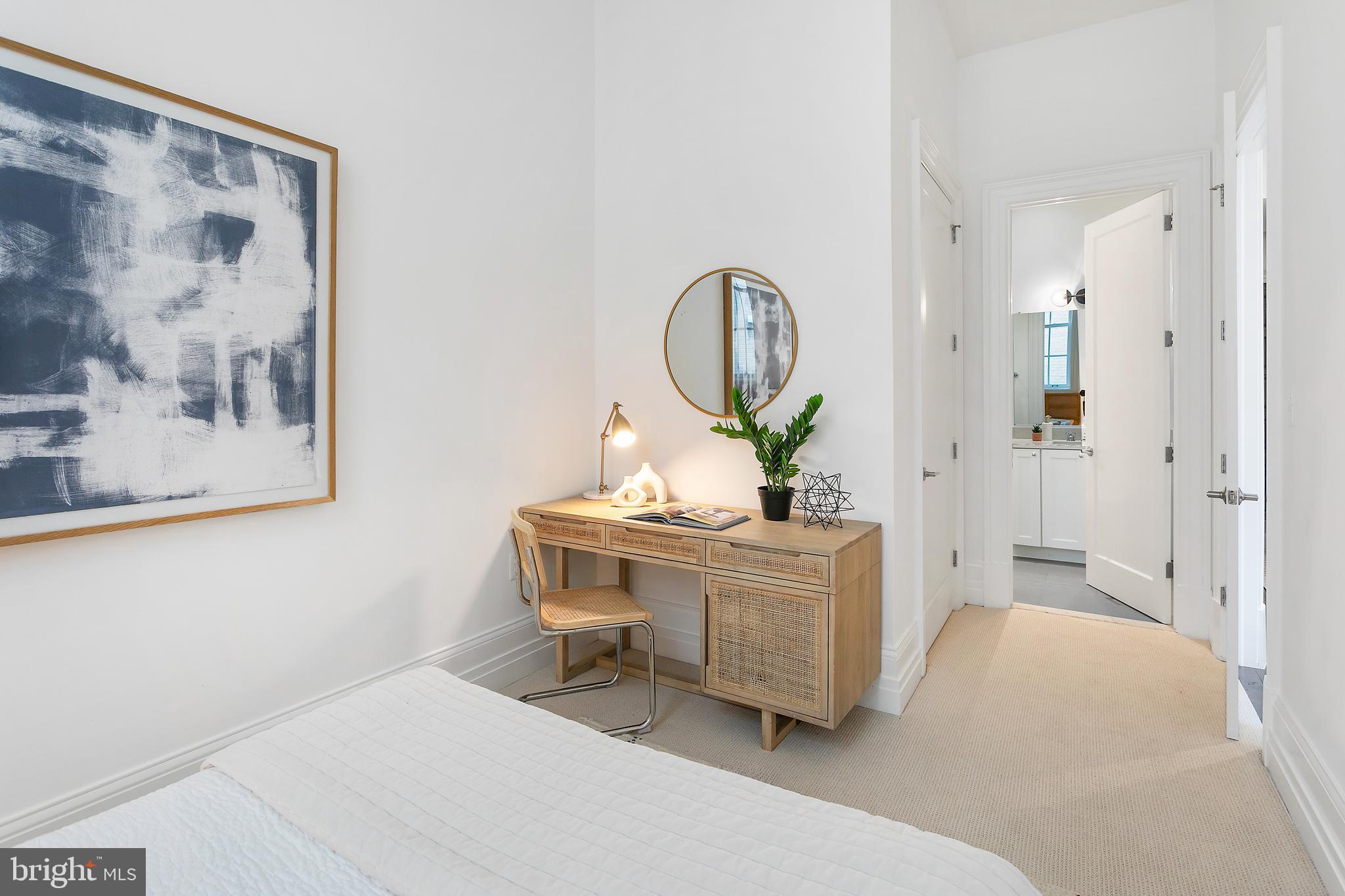 901 D Street Northeast, Unit 102 Washington, DC 20002 - Photo 25 of 40 a living room with furniture and a painting on the wall