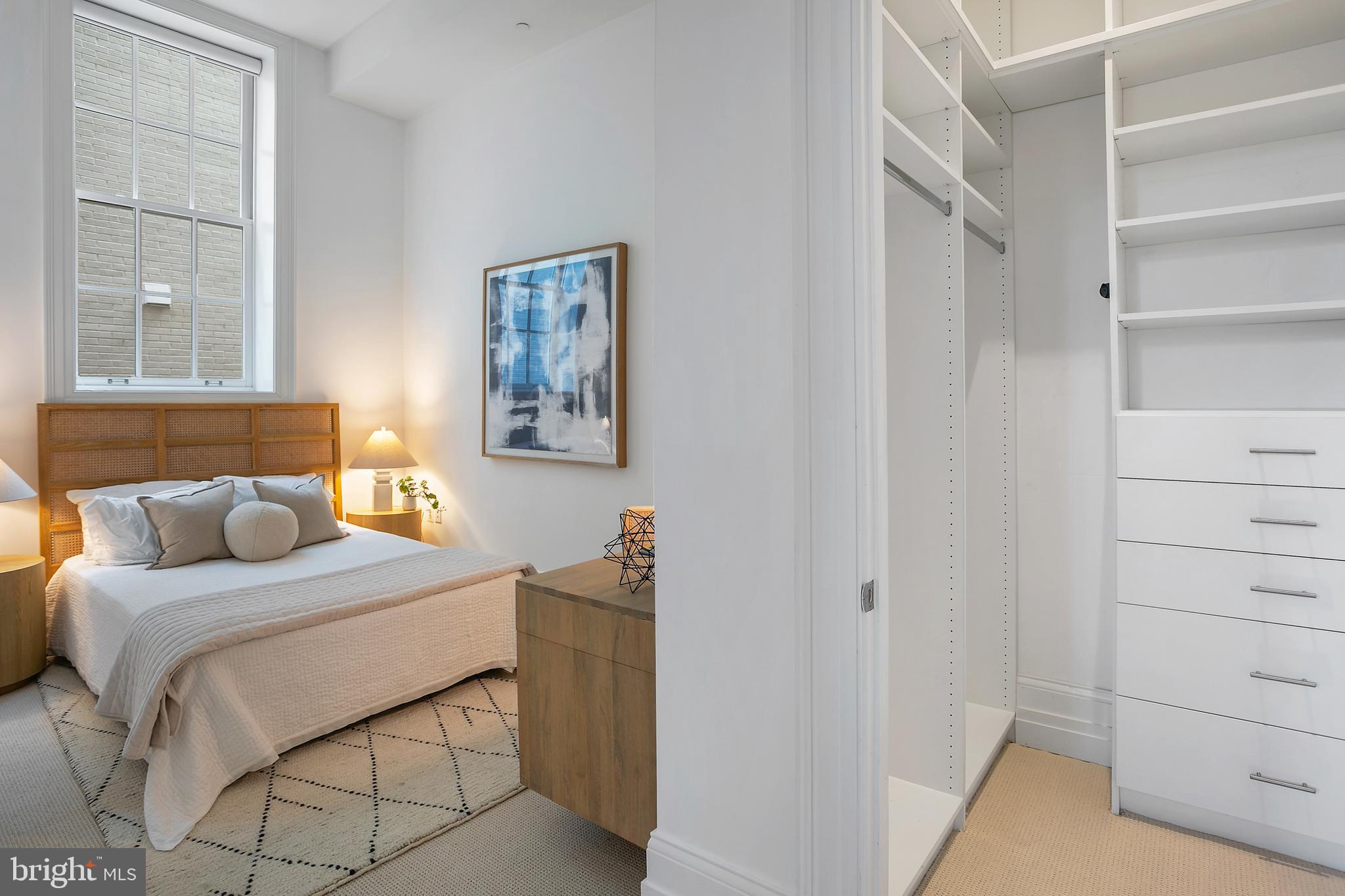 901 D Street Northeast, Unit 102 Washington, DC 20002 - Photo 26 of 40 a bedroom with a bed and a window