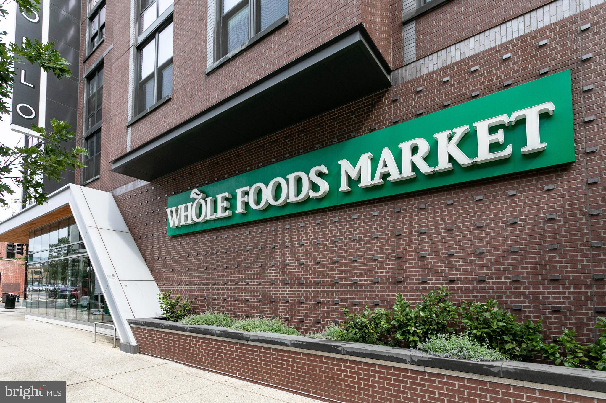 901 D Street Northeast, Unit 102 Washington, DC 20002 - Photo 39 of 40 a street sign on a brick building