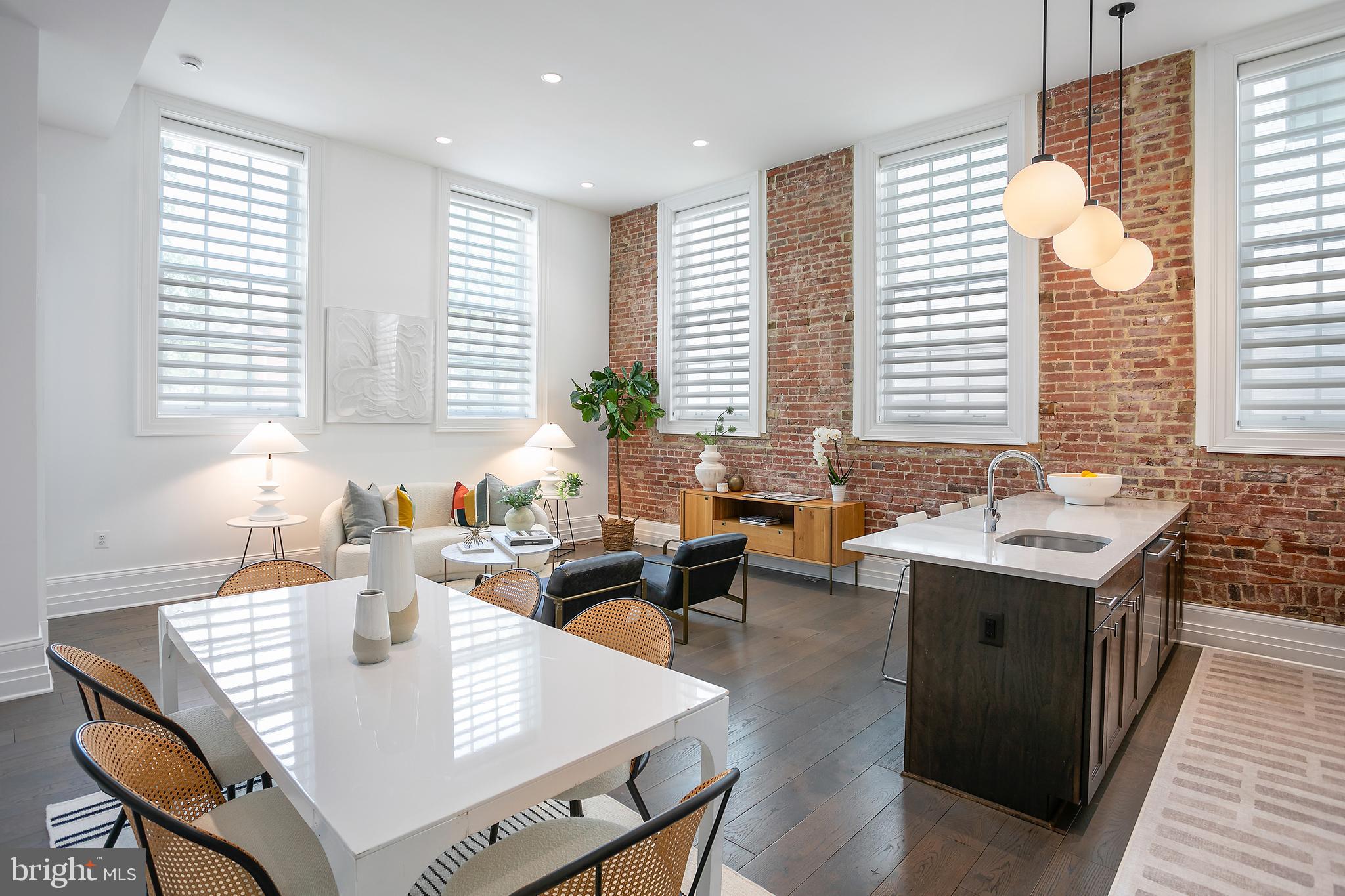 901 D Street Northeast, Unit 102 Washington, DC 20002 - Photo 4 of 40 a living room with granite countertop furniture and a large window