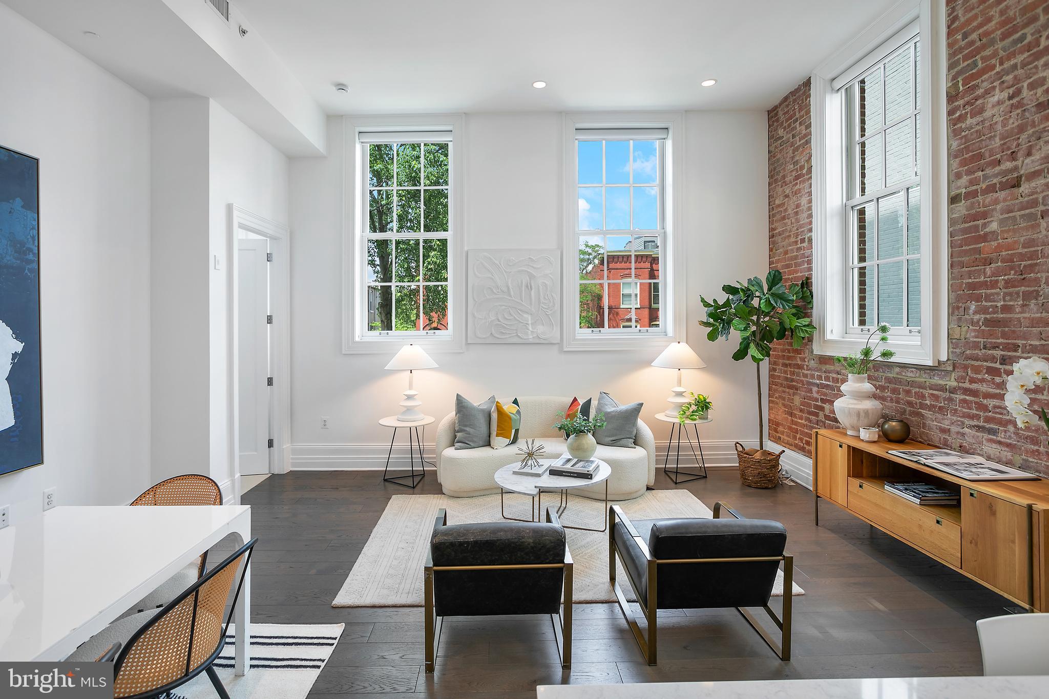 901 D Street Northeast, Unit 102 Washington, DC 20002 - Photo 7 of 40 a living room with furniture and windows