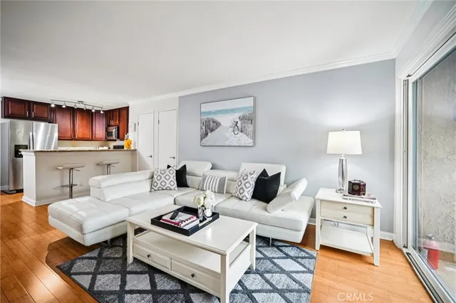 a living room with furniture and a lamp