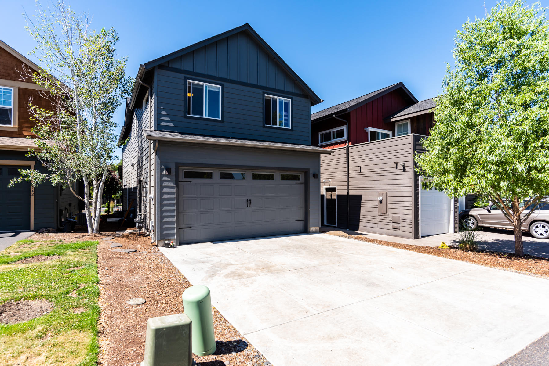 2546 Northwest Awbrey Road Bend, OR 97703 - Photo 21 of 22 a front view of a house with a yard and garage
