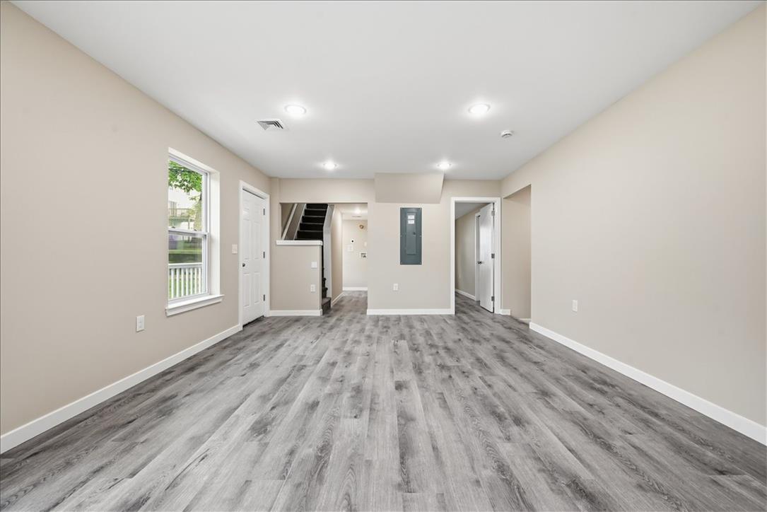 5641 North Coplay Road Whitehall, PA 18052 - Photo 14 of 68 A versatile open-concept living area boasts durable flooring and bright recessed lighting.