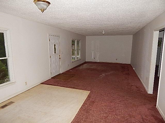 140 Adcock Hollow Road Coalfield, TN 37748 - Photo 6 of 11 Living Room from the Kitchen
