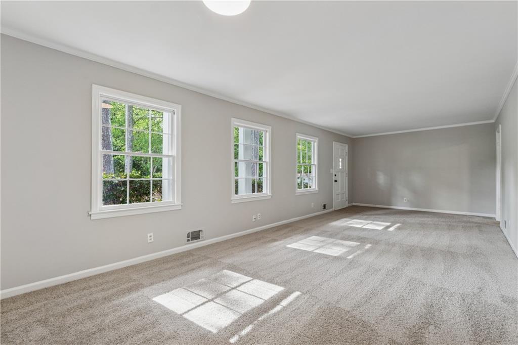4616 Greensprings Road Atlanta, GA 30337 - Photo 4 of 26 a view of an empty room with a window
